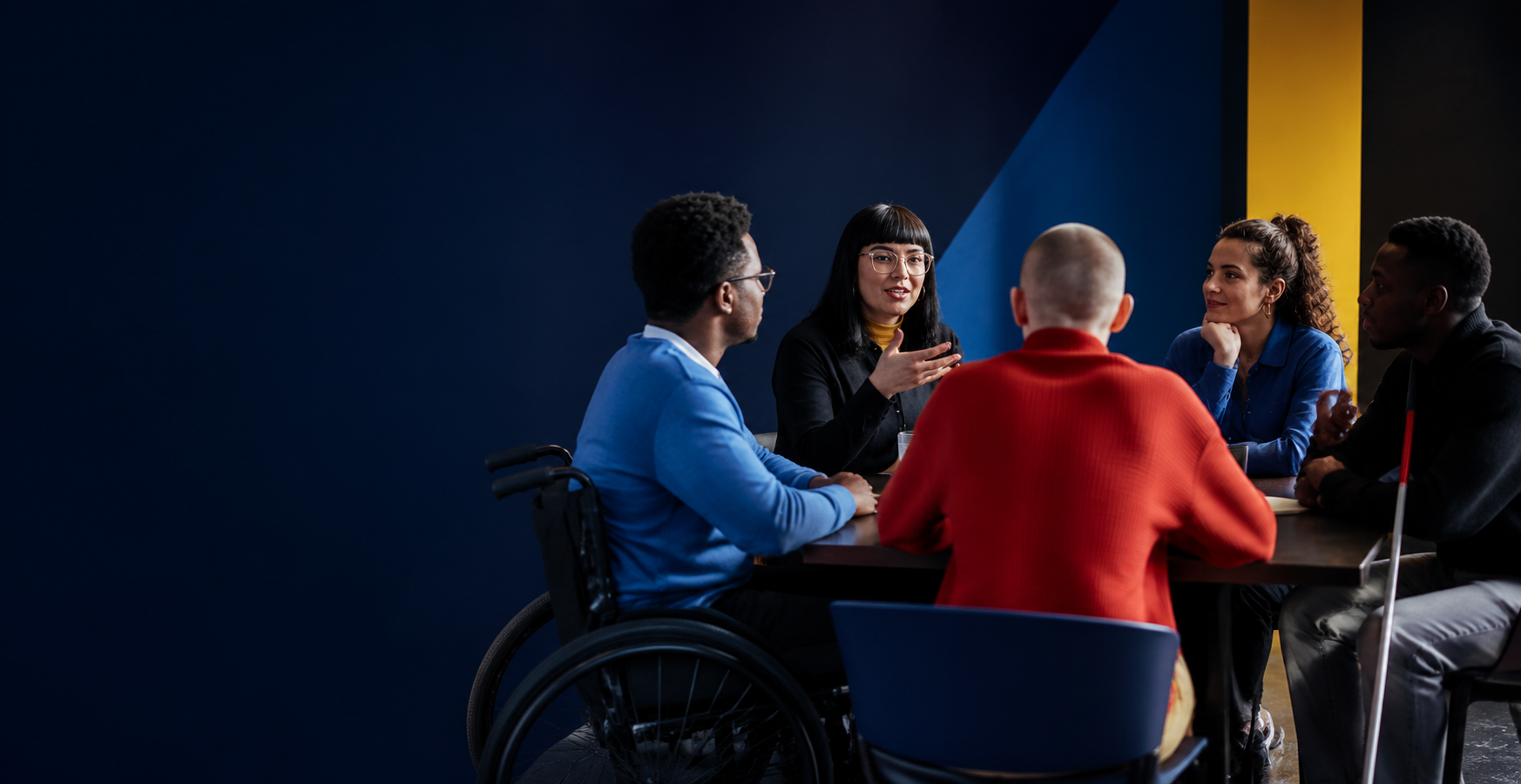 Disabled people leading and taking part in a group conversation